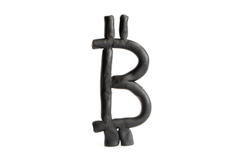Symbol of black bitcoin from plasticine on white background. finance concept
