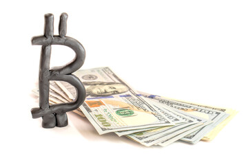 Plasticine bitcoin on a hundred dollar bill isolated on white background. finance concept