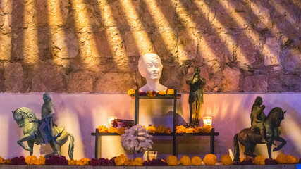 statues altar with marigold flowers