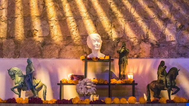 statues altar with marigold flowers