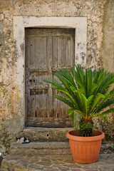 Fototapeta na wymiar The door of an old house in San Nicola Arcella, a medieval town in the Calabria region of Italy.