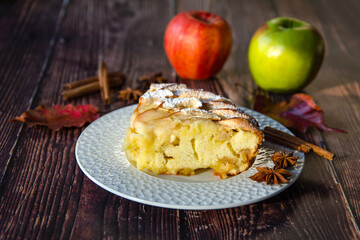 A piece of apple pie on a white plate. 