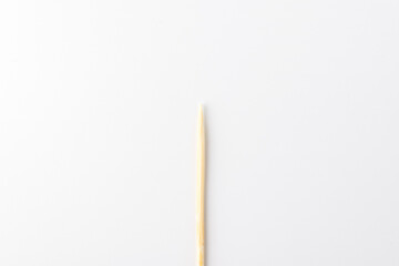 wooden toothpick on a white background