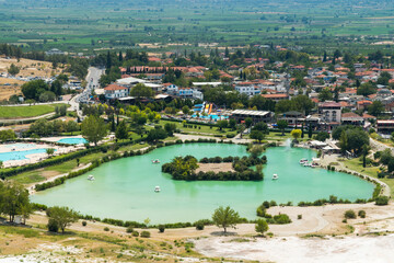 Fototapeta na wymiar A Lake and a Small Island Located near the Travertine Formations of Pamukkale