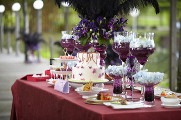 luxury wedding rom banquet sit down buffet party catering in pink purple rose color flower and...