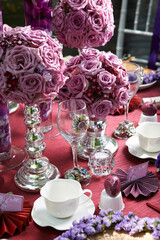 luxury wedding rom banquet sit down buffet party catering in pink purple rose color flower and black feather decoration with fusion halal menu at outdoor beautiful garden