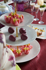 luxury wedding rom banquet sit down dessert buffet party catering in pink purple rose color flower and black feather decoration with fusion halal menu at outdoor beautiful garden