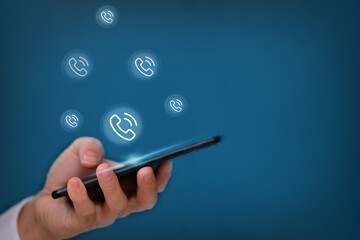 Businessman using smartphone on blue background and technology connection concept