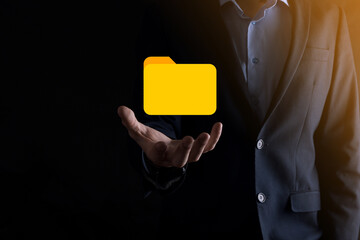 Businessman hold folder icon.Document Management System or DMS setup by IT consultant with modern...