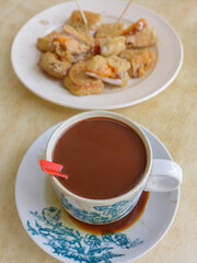 Morning breakfast snacks. Breakfast Desserts. In between meals' snacks, before or after the main dish. Sweet herbal soup, milk coofee and deep fried nian gao with yam, a popular delicacy.