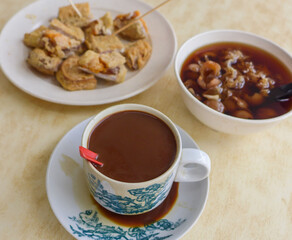 Morning breakfast snacks. Breakfast Desserts. In between meals' snacks, before or after the main dish. Sweet herbal soup, milk coofee and deep fried nian gao with yam, a popular delicacy.