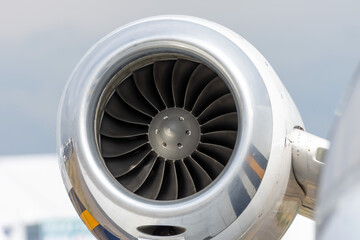Engine on the tail of a private small jet.