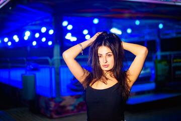 Night portrait of a charismatic girl