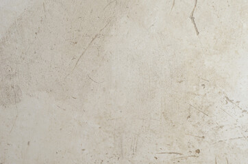 A light gray plastered wall. Scratched old wall in close-up. Abs