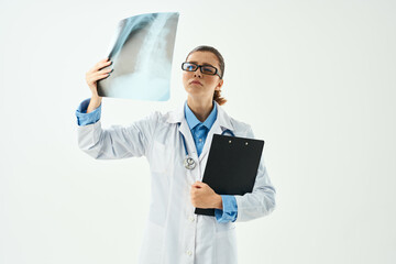 woman radiologist looking at x-ray close-up examination hospital