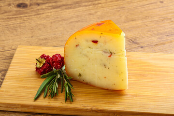 Hard cheese with dry tomato
