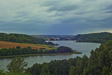 Fototapeta na wymiar Blue lake between green hills