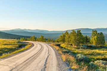 Dirt road in the highlands with a beautiful scenics landscape