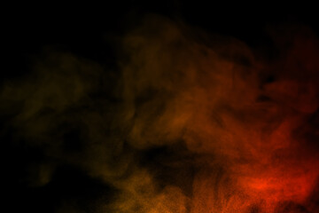 close-up of floating colorful steam smoke spray isolated on a black background
