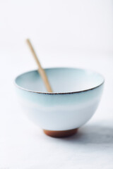 Traditional, handcrafted ceramic on bright wooden background. Soft focus. Close up.