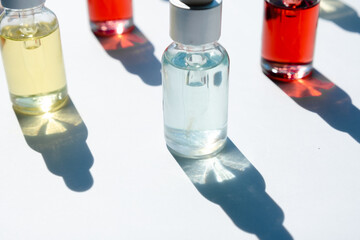 Dropper glass bottles with pipette. Transparent hyaluronic natural beauty mineral product and eco serum skin care concept. Top horizontal view copyspace. Summer juicy colors