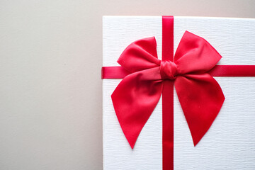Valentine present. Gift box and red ribbon for romantic couple.Gift box and ribbon with tag for valentine present