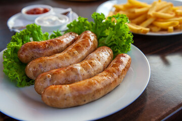 The Munich sausages with fries and sauce