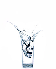 Water splash from glass on a white background. isolated