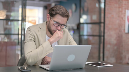 Young Man having Coughing at Work 