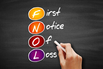 FNOL - First Notice Of Loss acronym, business concept on blackboard