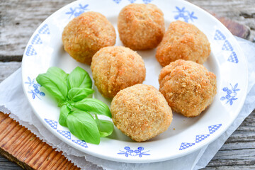 Italian arancini Cacio e pepe. Home made rice balls with mozzarella cheese ,parsley ,lemon and parmesan cheese.