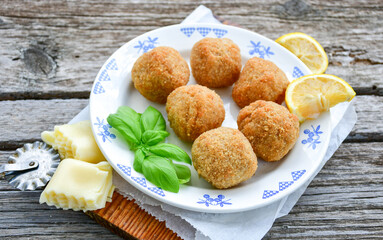 Italian arancini Cacio e pepe. Home made rice balls with mozzarella cheese ,parsley ,lemon and parmesan cheese.