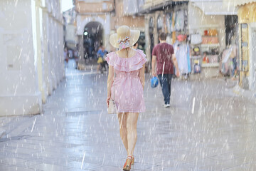 rain female in dress europe summer rainy day young woman tourism mediterranean