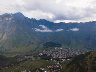 Obraz premium Georgia mountains blue sky aerial drone photo waterfalls and lakes green hills