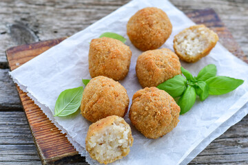 Italian arancini. Home made rice balls with mozzarella cheese,parsley ,lemon and parmesan cheese.