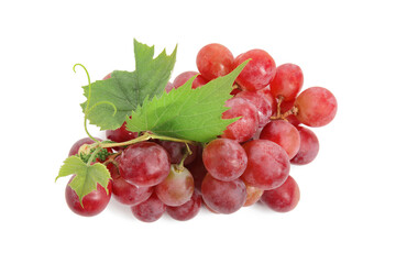 Cluster of ripe red grapes with green leaves on white background, top view