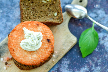 Homemade ketogenic  Salmon Burger with Tartar Sauce and  whole grain ketgenic bread. Healty food