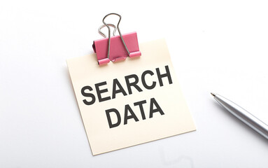 SEARCH DATA text on the sticker with pen on the white background