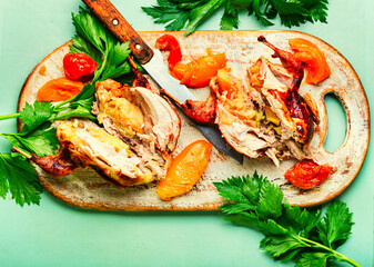 Quail baked on a cutting board