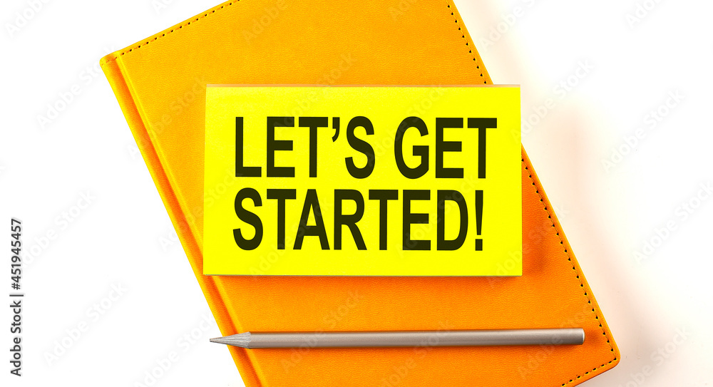 Poster text let's get started on the sticker on the yellow notebook