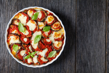 eggplant parmigiana in a baking dish, top view