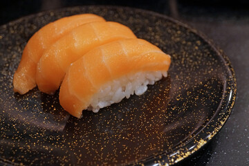 Salmon sushi nigiri on ceramic dish, Traditional Japanese food