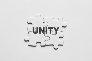 Unity, synergy, integration or solidarity concept with jigsaw puzzle pieces connected to each other