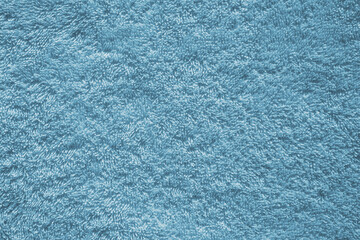 Fototapeta na wymiar Texture of fluffy blue cotton bath towel, Fabric cloth downy background, Close up