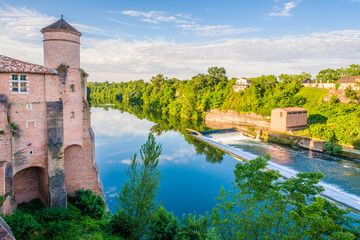 Morning view at the Tarn river with tower of Church of Saint Michel in Gaillac, France