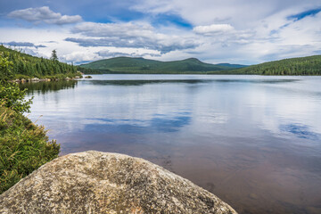 Lake, mountains and forest during summer in Parc National des Grands Jardins in Charlevoix, Quebec (Canada)