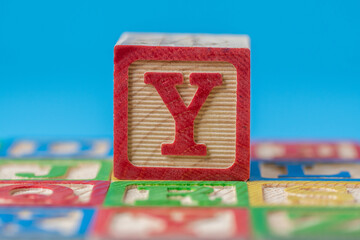 Closeup shot of an education alphabet ABC wooden block with the letter Y
