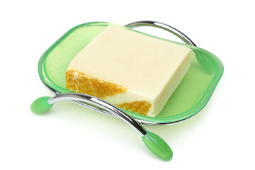 Green plastic soap dish with handmade natural honey soap