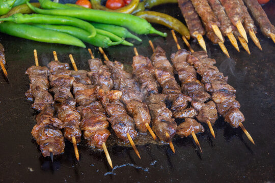 Roasting Frigarui ,skewers,on an outdoors grill