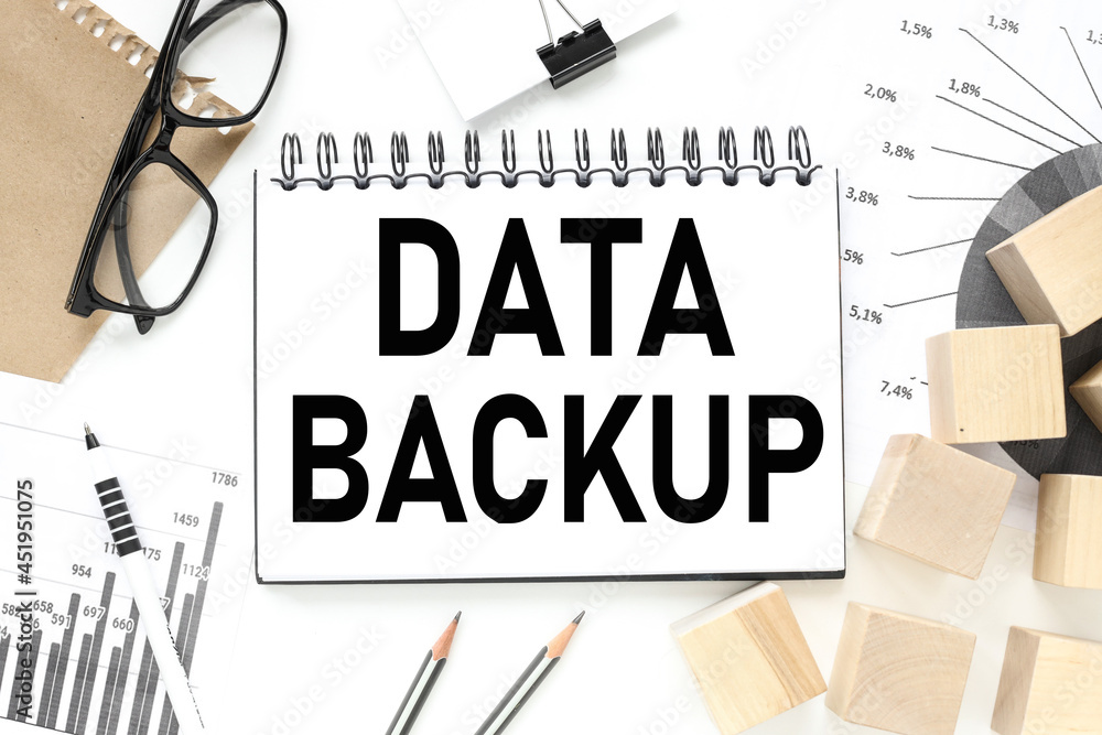 Poster data backup. on a white table on the background of financial charts